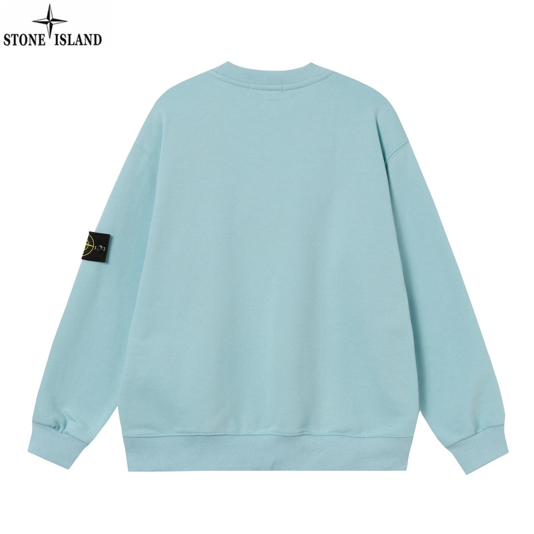 Light blue crewneck sweatshirt, back view, with ribbed hem and sleeve patch