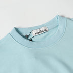Light blue crewneck sweatshirt neckline with inner brand neck label