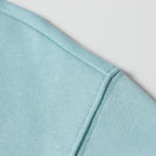 Light blue sweatshirt shoulder and collar ribbing detail