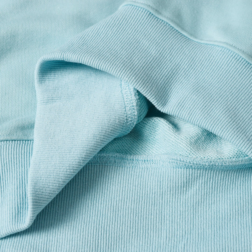 Light blue sweatshirt sleeve seam and ribbed cuff detail