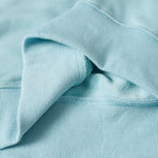 Light blue sweatshirt sleeve seam and ribbed cuff detail