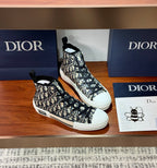 Dior high-top sneakers with black-and-white monogram canvas, side lace detail