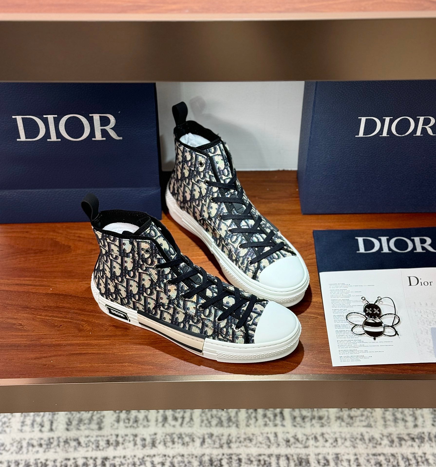 Dior high-top sneakers with black-and-white monogram canvas, side lace detail