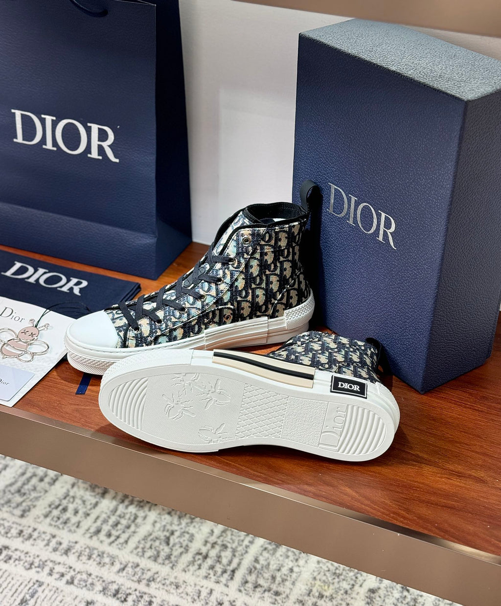 Dior high-top sneakers with black-and-white monogram upper, white outsole detail