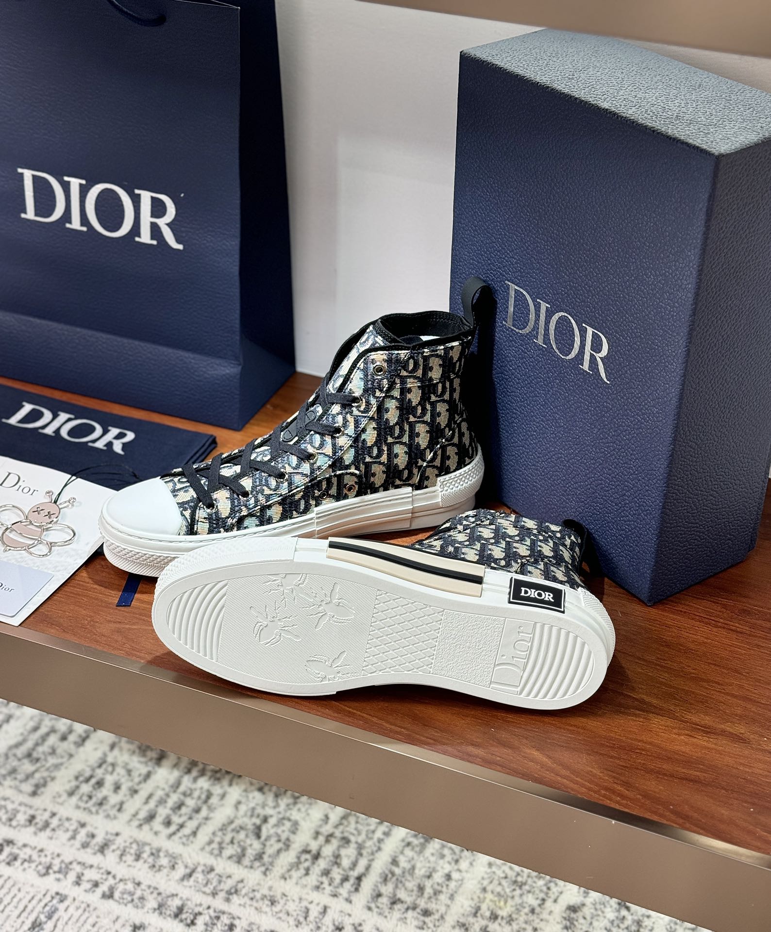 Dior high-top sneakers with black-and-white monogram upper, white outsole detail