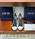 Dior high-top sneakers with black-and-white monogram canvas, lace-up front