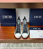 Dior high-top sneakers with black-and-white monogram canvas, lace-up front