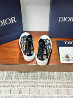 Dior ladies high-top sneakers, back view with heel pull tabs and monogram canvas