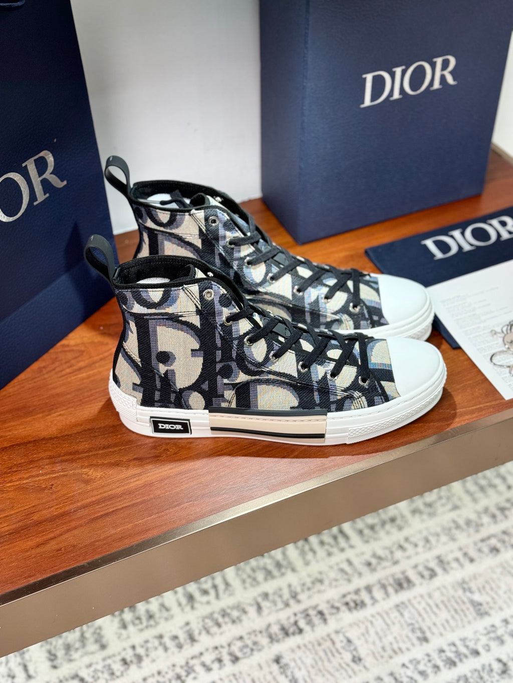 Dior ladies high-top sneakers, side view, black-and-beige monogram canvas with white sole