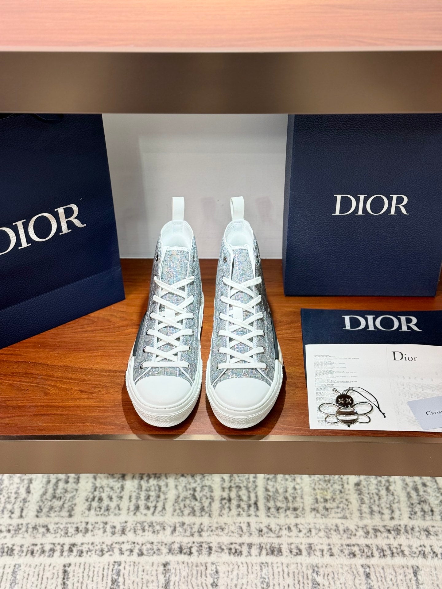 Women's patterned high-top sneakers with white laces and white rubber soles