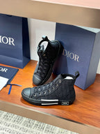 Dior ladies lace-up high-top sneakers in dark leather with monogram-style pattern and white edge