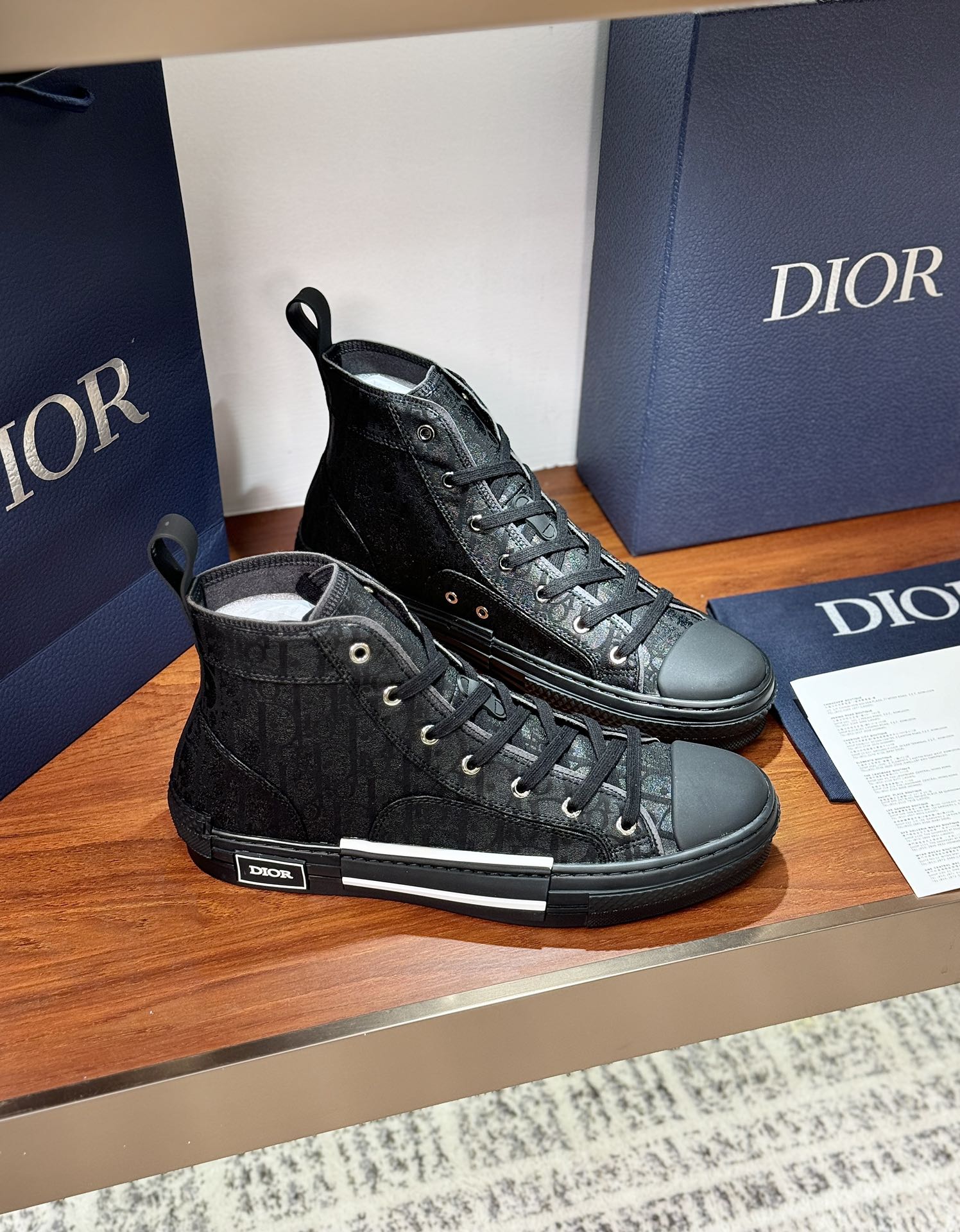 Ladies dark lace-up high-top sneakers with textured fabric and white trim