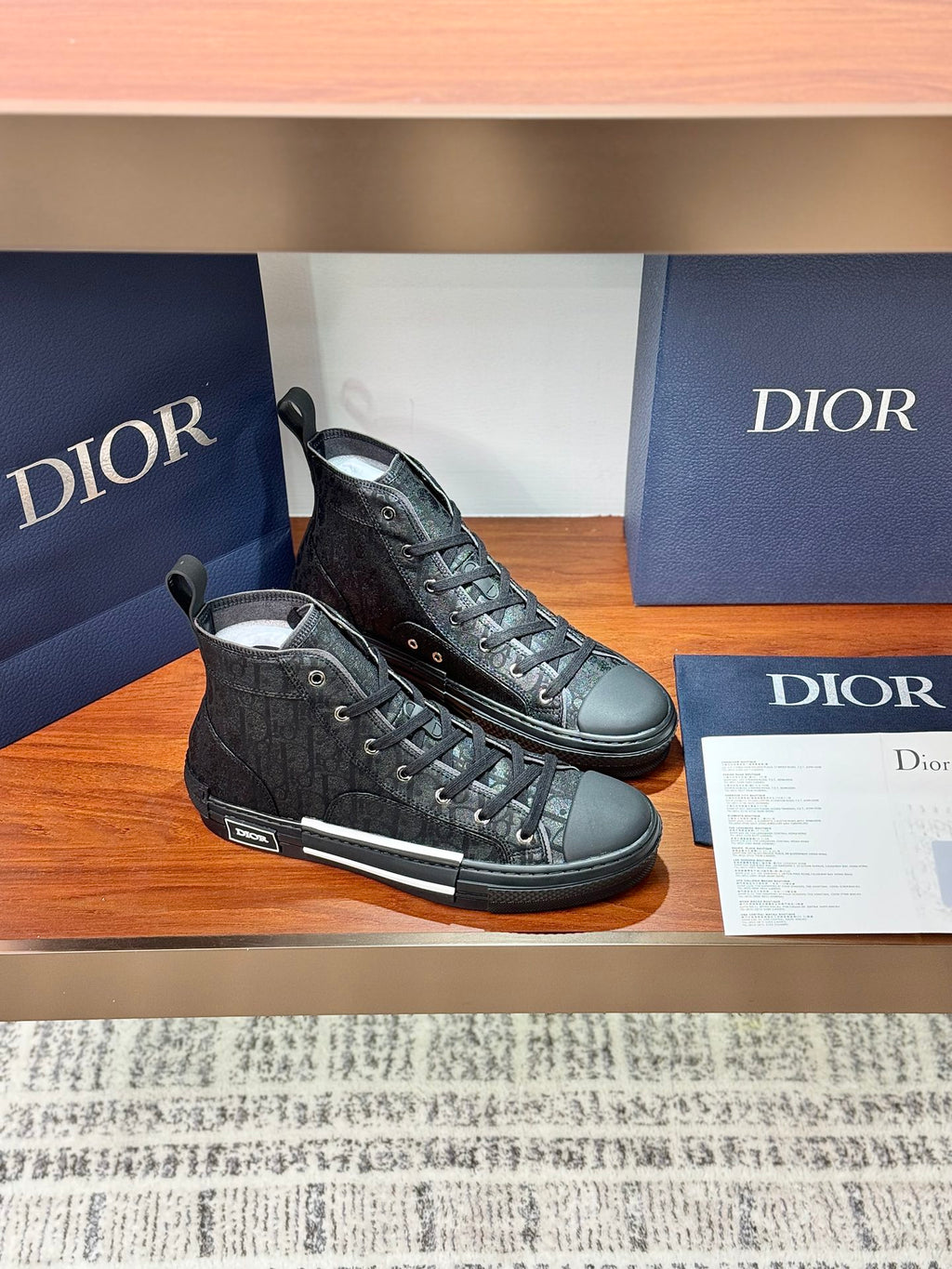 Ladies dark lace-up high-top sneakers, one side view with textured upper