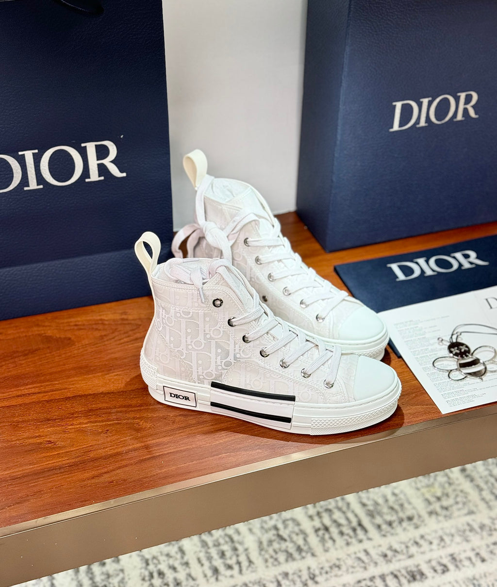 Dior white high-top lace-up sneakers with side logo patch and black accent stripe