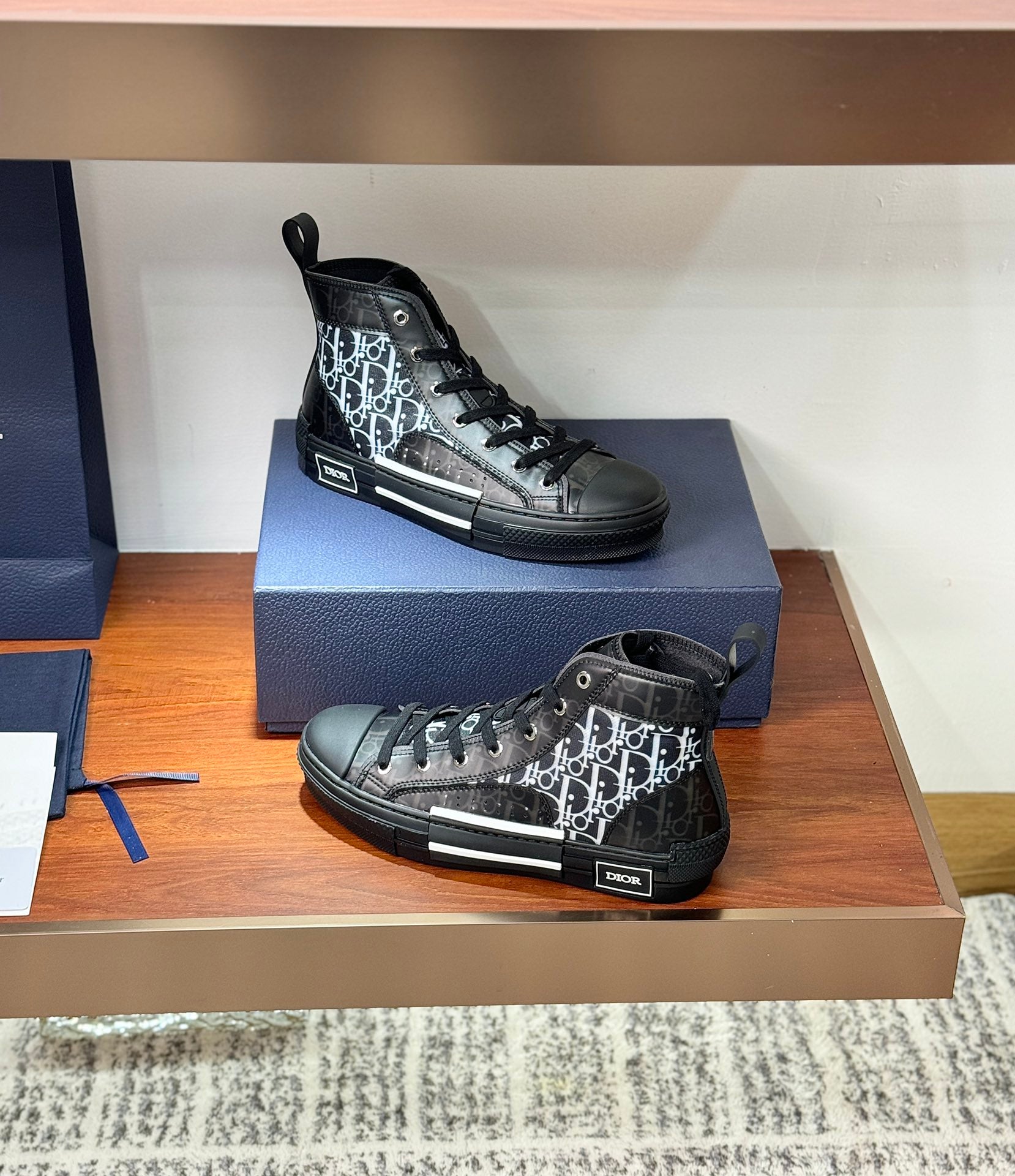 Women’s high-top sneakers with Dior monogram panels, on box display