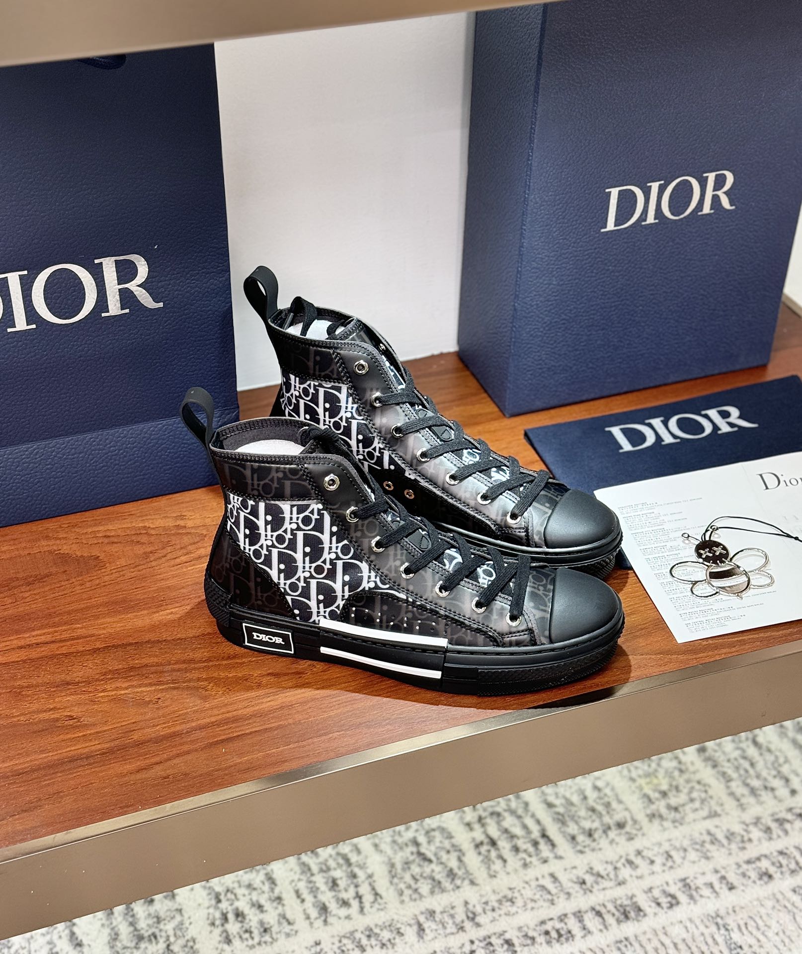 Women’s high-top sneakers with Dior monogram panels, angled pair