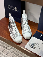 Dior ladies high-top sneakers, white with black monogram print and woven eyelets