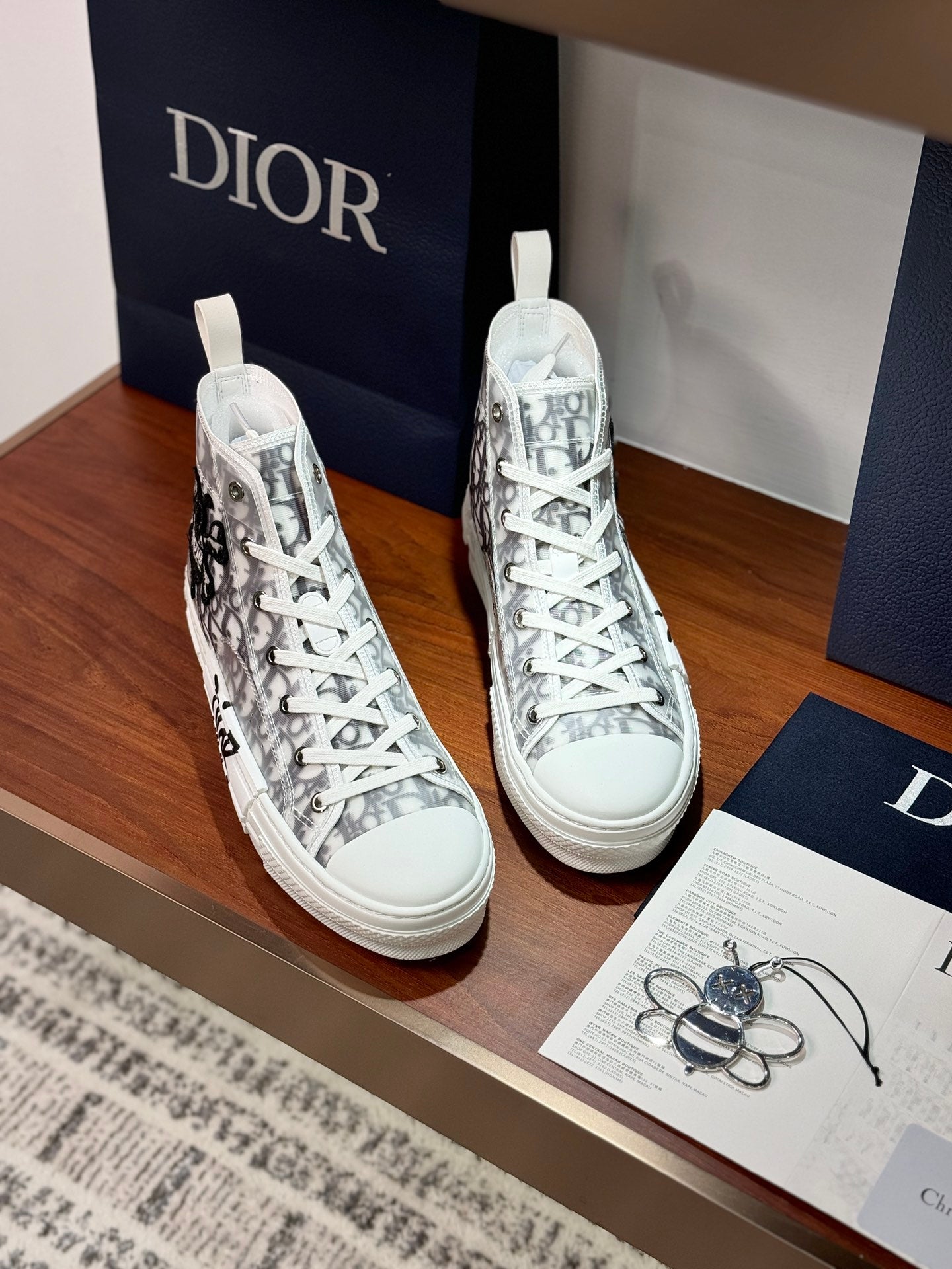 Dior ladies high-top sneakers, white with black monogram print and woven eyelets