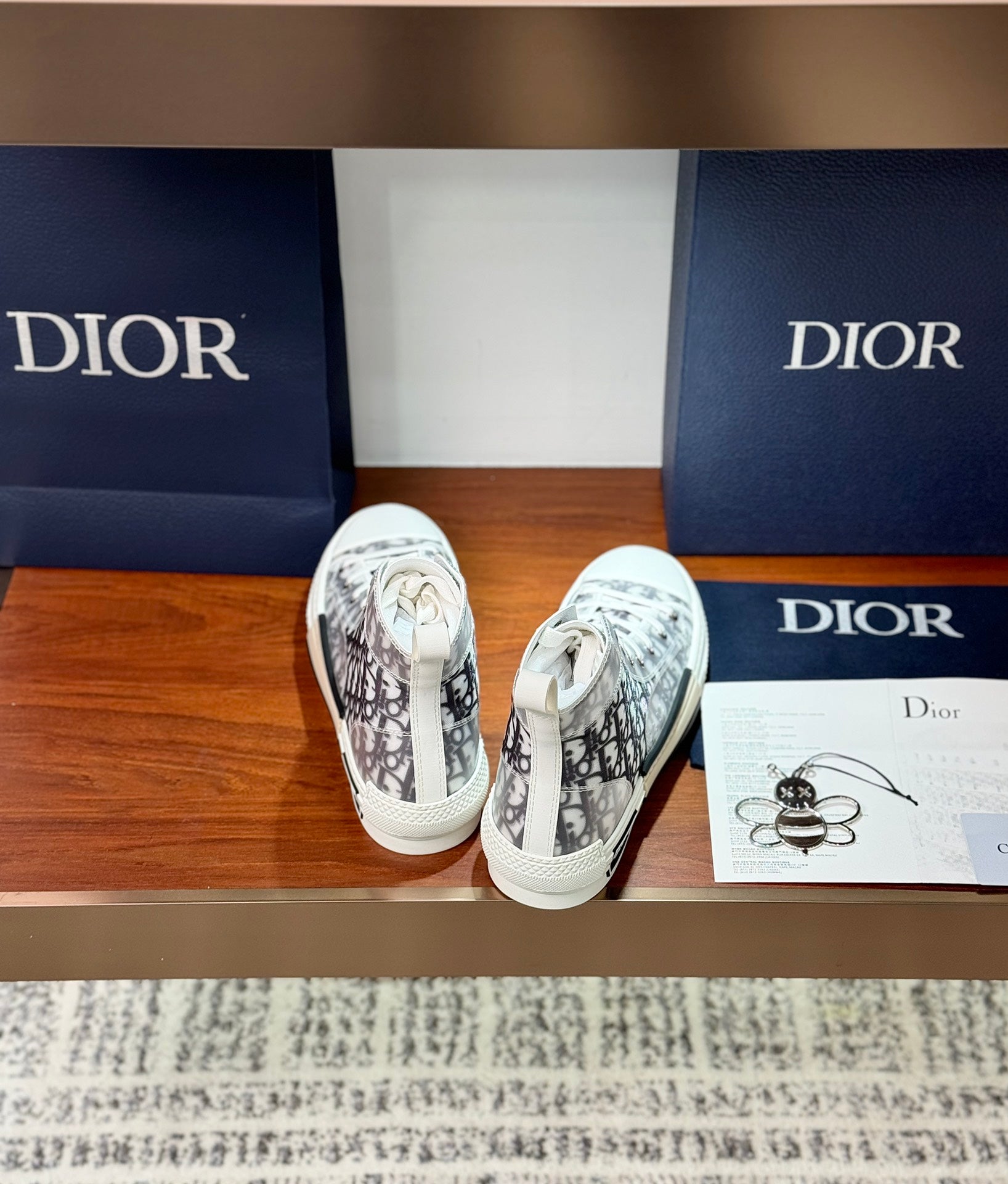 White Dior monogram high-top sneakers with laces, shown from the top opening