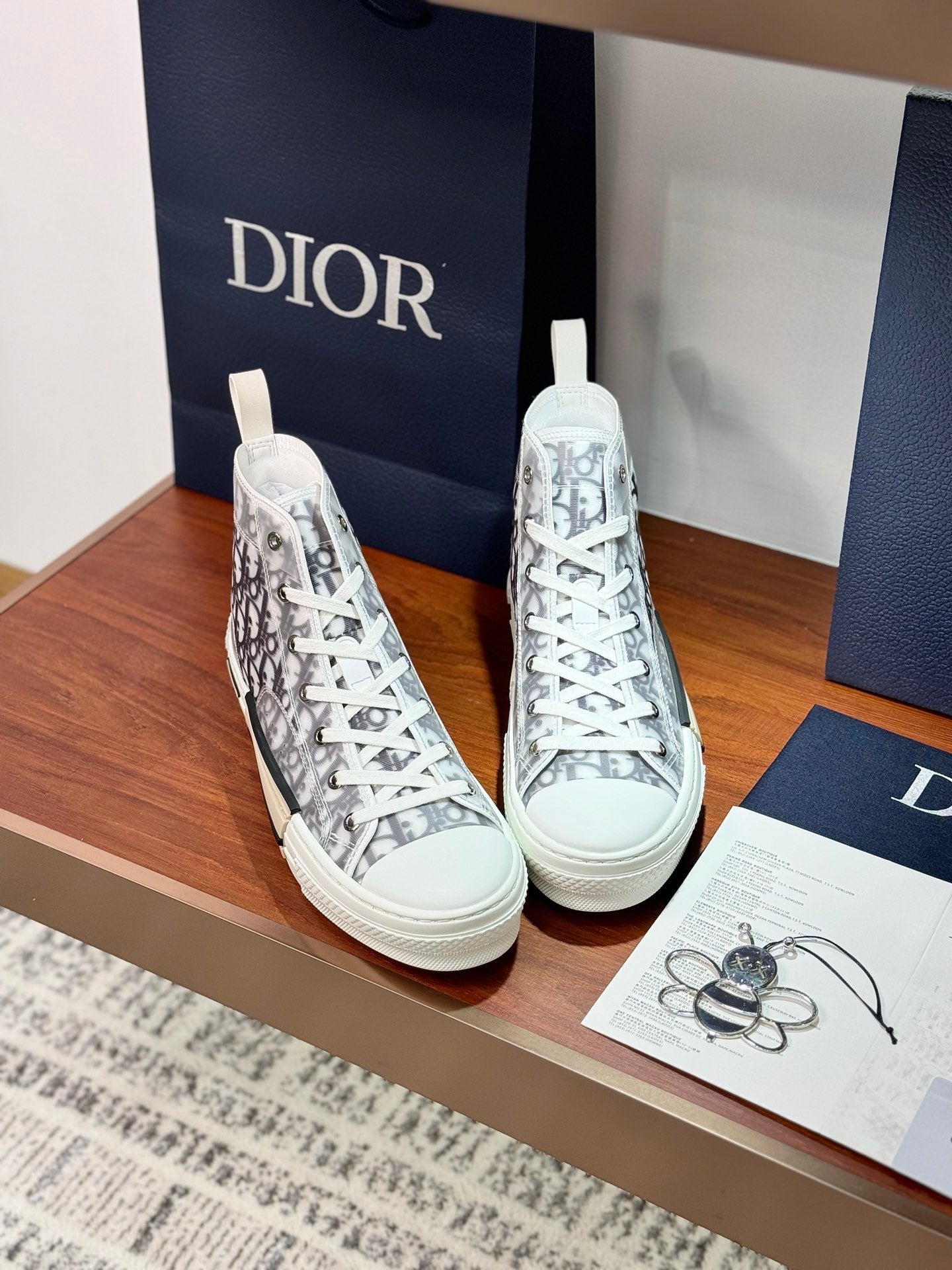 White lace-up Dior monogram high-top sneakers with rubber toe cap