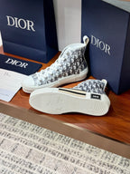 White Dior monogram high-top sneaker with visible outsole tread and side logo