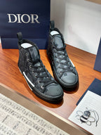 Dior ladies lace-up high-top sneakers, dark gray uppers with white side trim and sole.