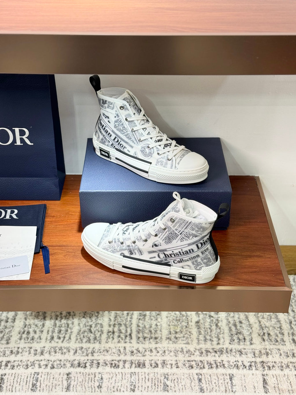 White Dior ladies sneakers with lace-up, patterned canvas and rubber toe cap