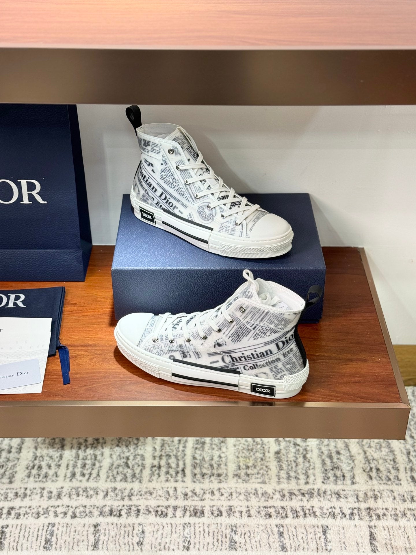 White Dior ladies sneakers with lace-up, patterned canvas and rubber toe cap