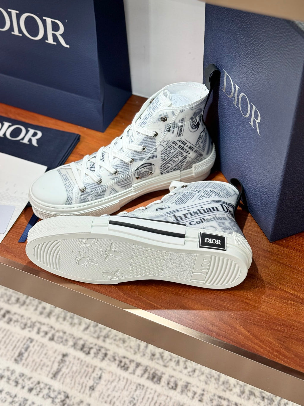 White Dior ladies sneakers with lace-up and patterned sole, front corner view
