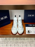 White Dior ladies high-top sneakers with lace-up closure and printed script
