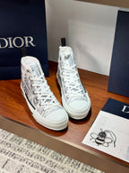White Dior ladies high-top sneakers with lace-up, angled front view