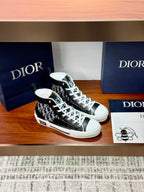 Pair of high-top Dior sneakers, black monogram upper with white laces and toe cap