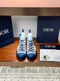 Pair of high-top sneakers with blue and white Dior monogram print