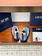 High-top sneakers with Dior monogram print and blue rubber caps, rear view