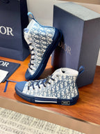 High-top sneakers with blue and white Dior monogram print, angled pair