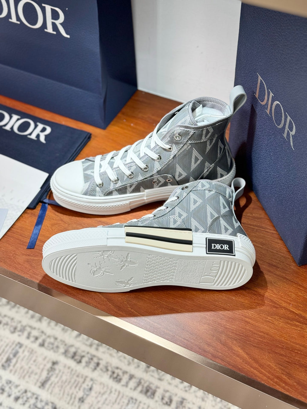 Gray Dior high-top sneakers with geometric monogram and white rubber outsole