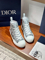 Gray Dior high-top sneakers, lace-up style with monogram print side panels