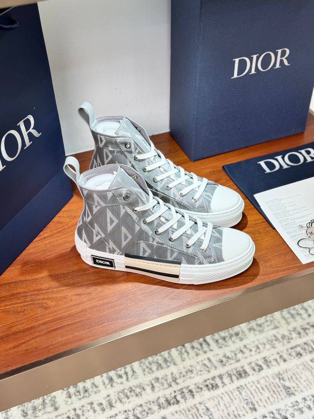 Gray Dior high-top sneakers with geometric monogram and lace-up front