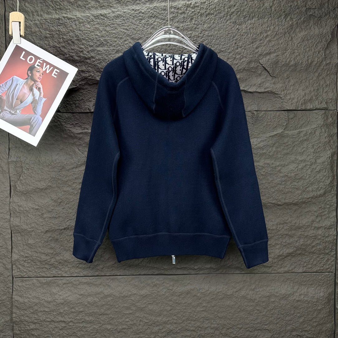 Dior long zip-up hoodie in dark navy, front view with hood, center zipper, drawstrings