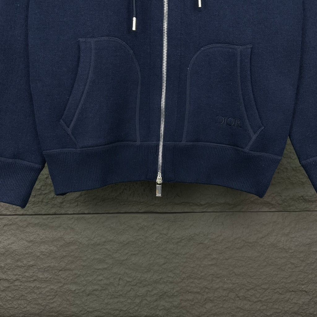 Dior long hoodie lower front close-up with two large hooded pockets and center zipper
