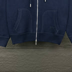 Dior long hoodie lower front close-up with two large hooded pockets and center zipper