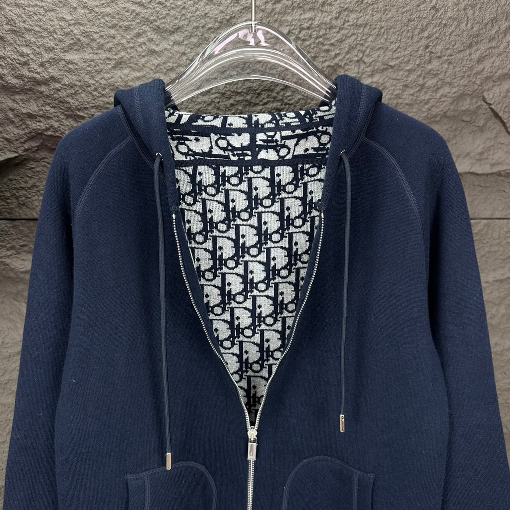 Dior long zip-up hoodie with patterned hood lining, dark navy outer, pouch pockets