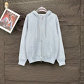 Light blue Dior zip-up hoodie with drawstring hood and front pockets