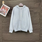 Light blue Dior zip-up hoodie with drawstring hood and front pockets