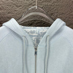 Light blue Dior zip-up hoodie close-up of hood lining and zipper pull