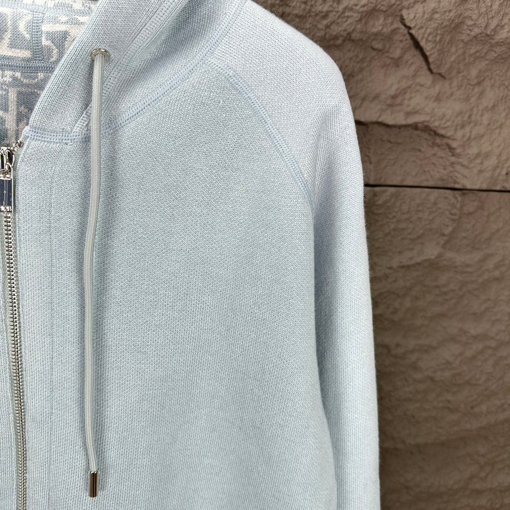 Light blue Dior zip-up hoodie sleeve and side of front zipper