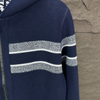 Navy zip hoodie with wide white horizontal stripe on sleeves and body