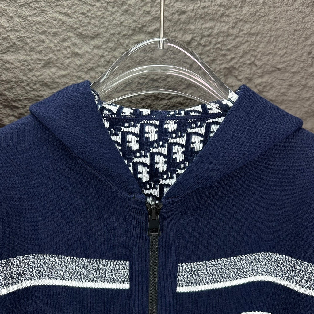 Navy zip hoodie hood with patterned lining and central metal zipper