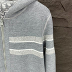 Dior zip hoodie sleeve with light gray knit and horizontal striped band