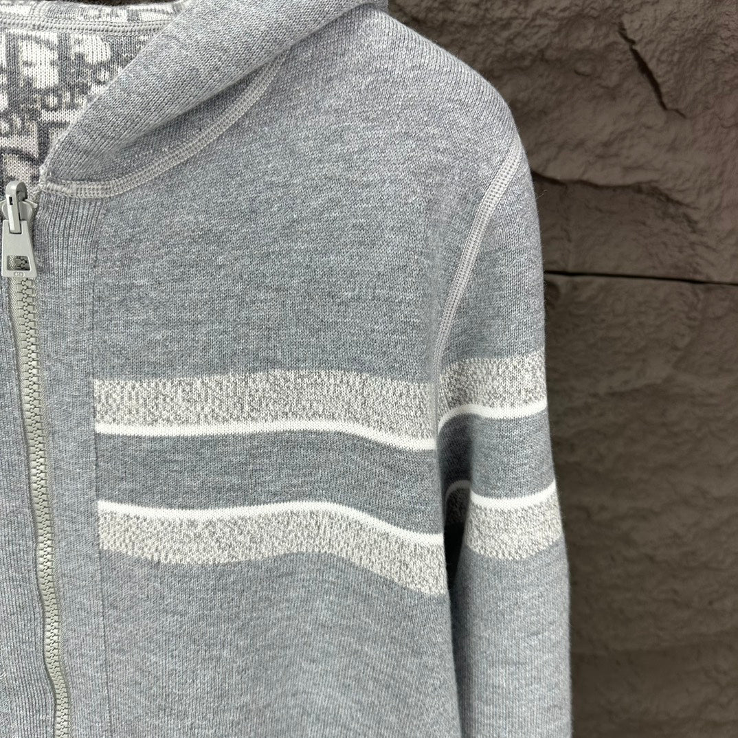 Dior zip hoodie sleeve with light gray knit and horizontal striped band